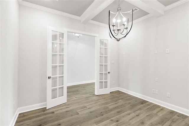 unfurnished dining area featuring hardwood / wood-style floors, an inviting chandelier, french doors, crown molding, and beamed ceiling