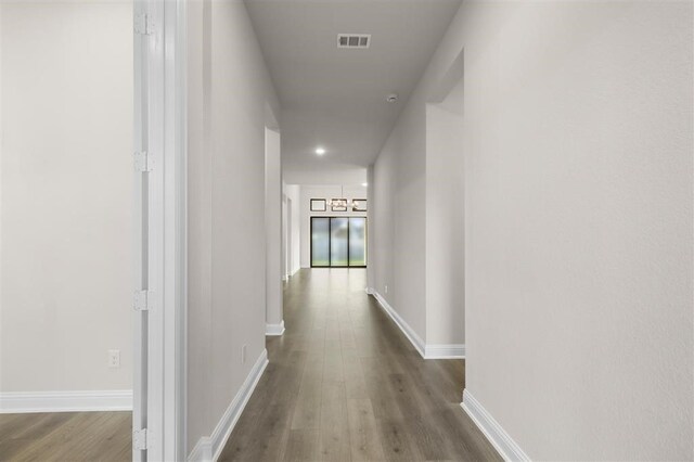 hall featuring hardwood / wood-style flooring