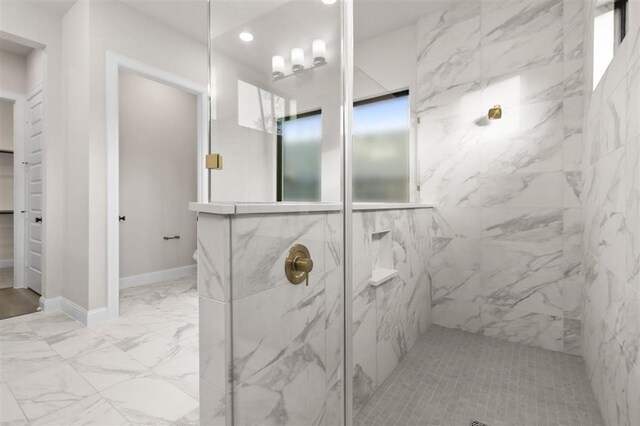 bathroom featuring a tile shower