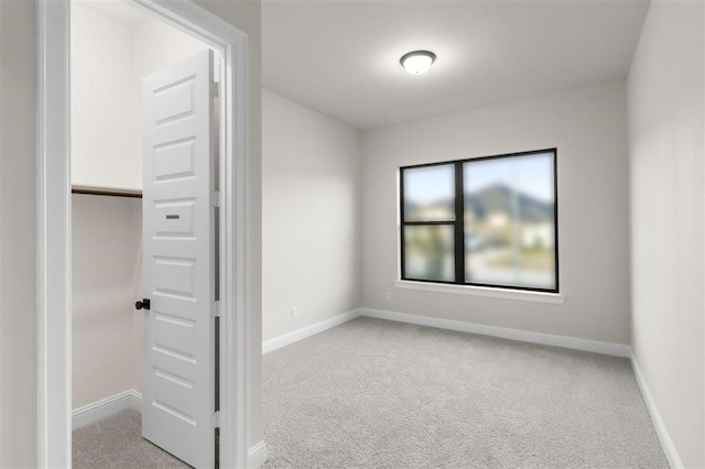 spare room with light carpet