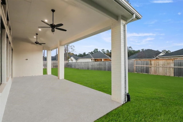 view of patio featuring ceiling fan