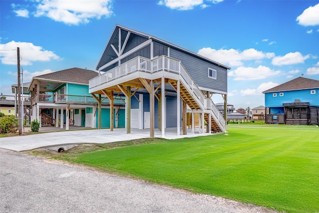 view of front of property featuring a garage and a front lawn