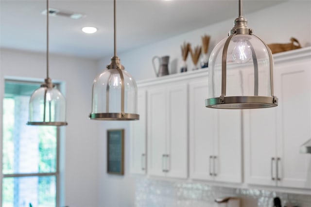 details with white cabinets and pendant lighting