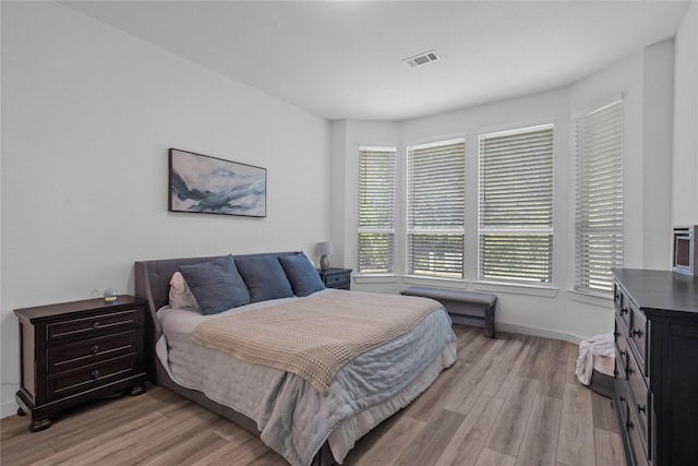 bedroom with light hardwood / wood-style flooring