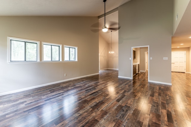 unfurnished living room with high vaulted ceiling, ceiling fan, and hardwood / wood-style flooring