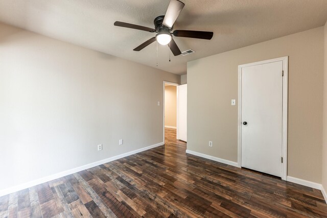 spare room featuring wood-type flooring and ceiling fan