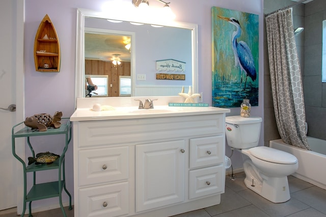 full bathroom featuring ceiling fan, toilet, tile patterned flooring, vanity, and shower / bathtub combination with curtain