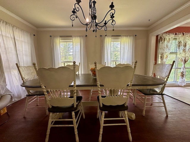 dining area featuring a healthy amount of sunlight and ornamental molding