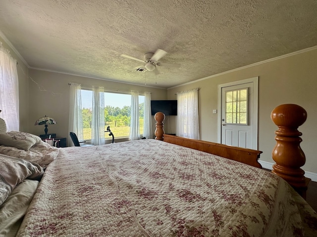 bedroom featuring ceiling fan, a textured ceiling, and crown molding