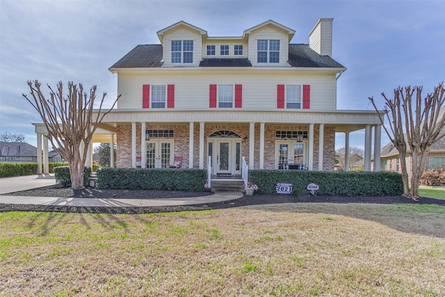 view of front of house featuring a front lawn and a porch