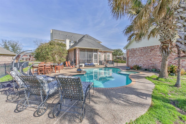 view of swimming pool with a patio area