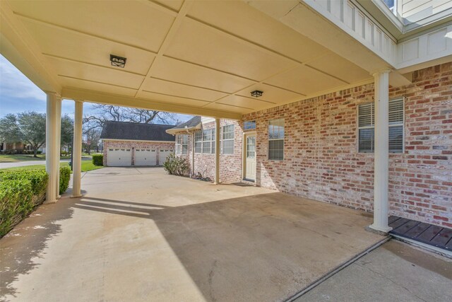 view of terrace with a garage and an outdoor structure