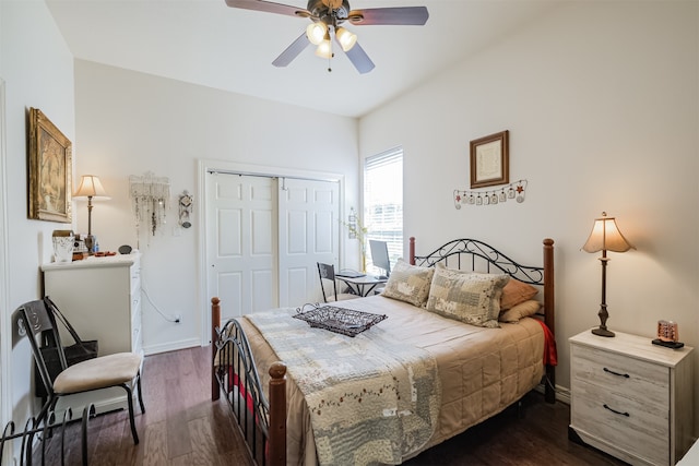 bedroom with dark hardwood / wood-style flooring, a closet, and ceiling fan