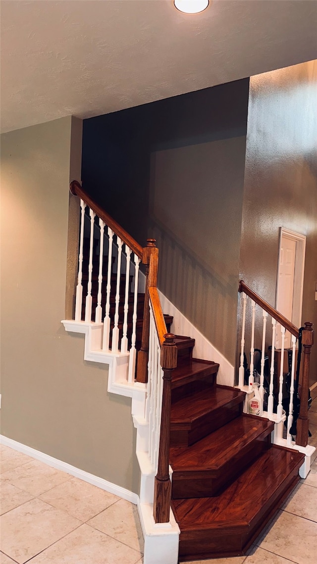 staircase with tile flooring