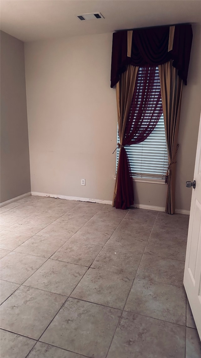 view of tiled spare room