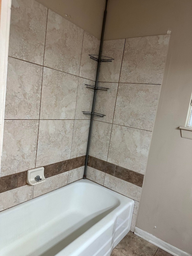 bathroom featuring shower / bath combination and tile patterned floors