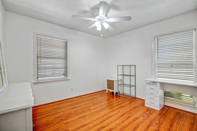 spare room with ceiling fan and light hardwood / wood-style flooring