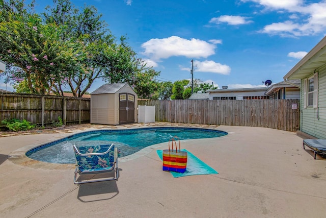 view of pool featuring a storage shed and a patio