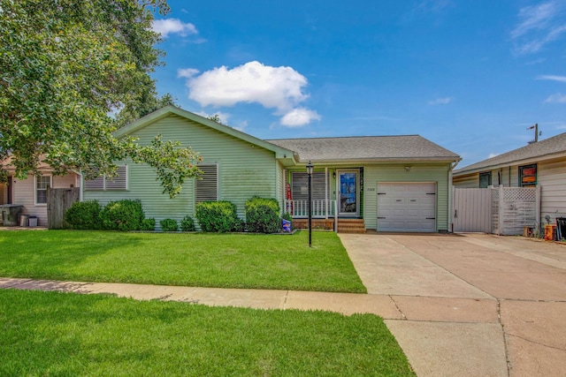 ranch-style home with a front yard, a garage, and a porch