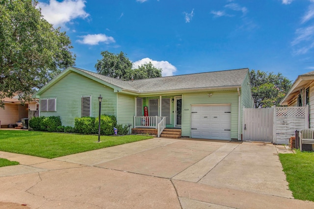 ranch-style house featuring a garage, a front lawn, and covered porch