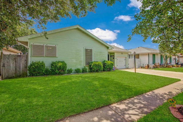 ranch-style home featuring a front yard and a garage