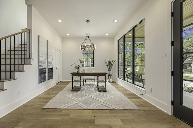 dining area with a chandelier and dark hardwood / wood-style flooring