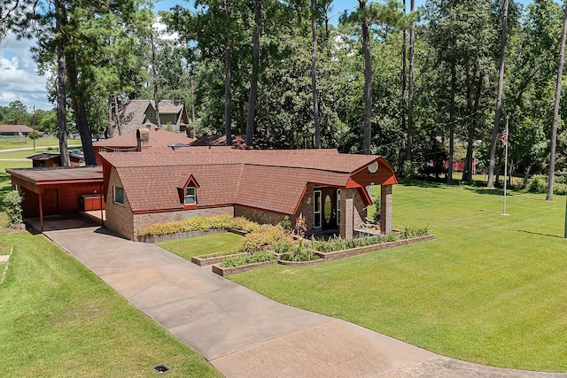 view of front of house with a front yard and a carport