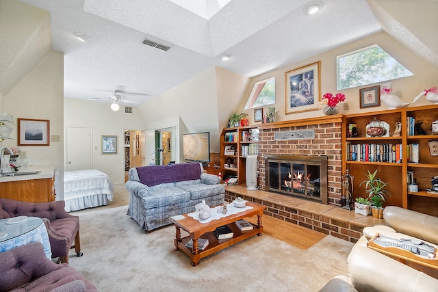 carpeted living room with lofted ceiling, ceiling fan, a textured ceiling, and a fireplace