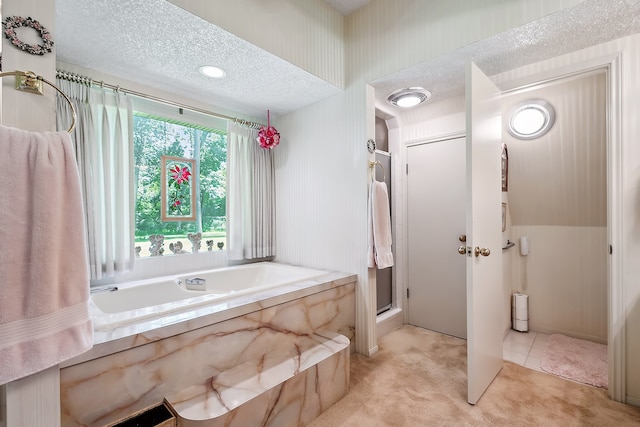 bathroom featuring tile floors, a textured ceiling, and plus walk in shower