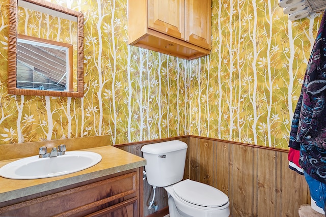 bathroom featuring oversized vanity and toilet