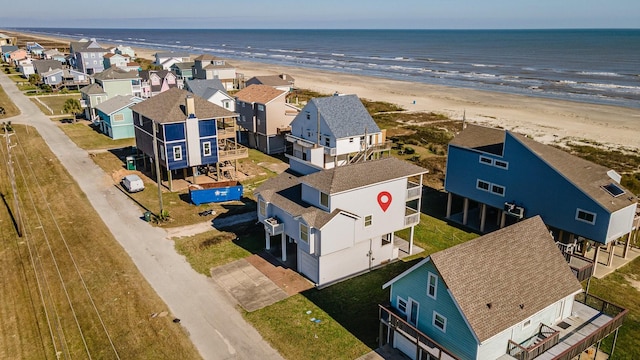 aerial view featuring a water view and a view of the beach