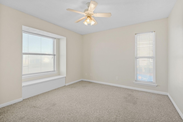 empty room featuring carpet floors and ceiling fan