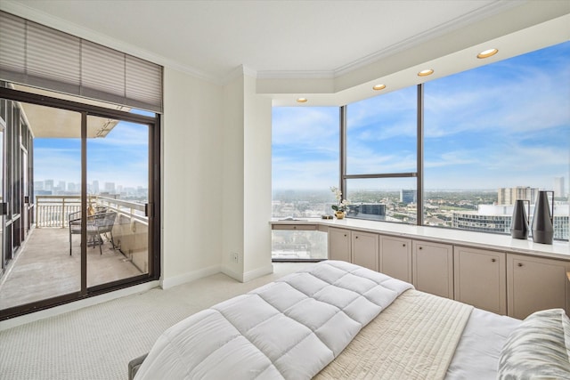 carpeted bedroom featuring access to outside and ornamental molding