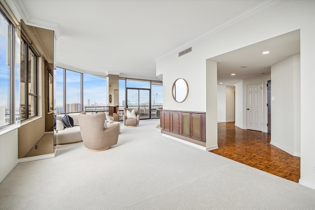 living room featuring dark parquet flooring and crown molding