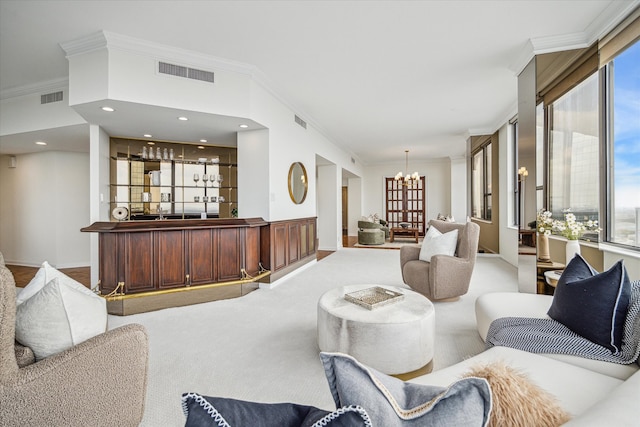 carpeted living room with indoor bar, an inviting chandelier, and ornamental molding