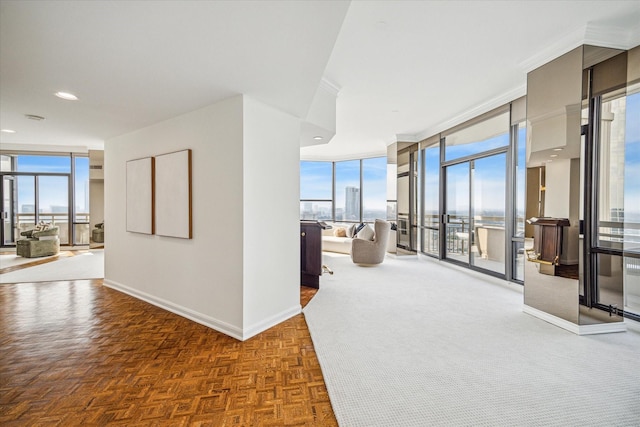 interior space with expansive windows and a healthy amount of sunlight