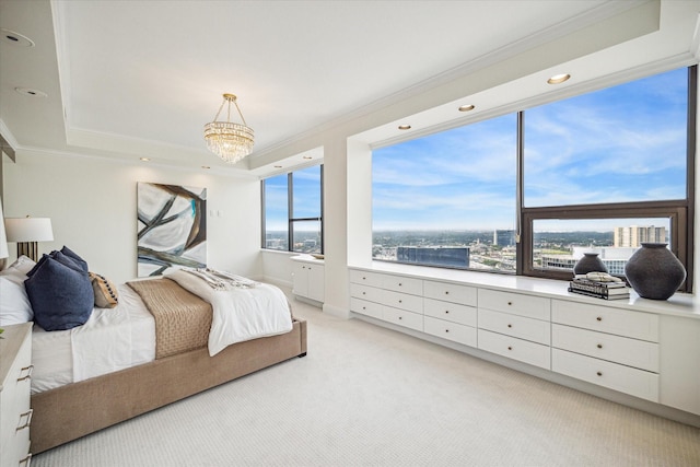 carpeted bedroom featuring crown molding and an inviting chandelier