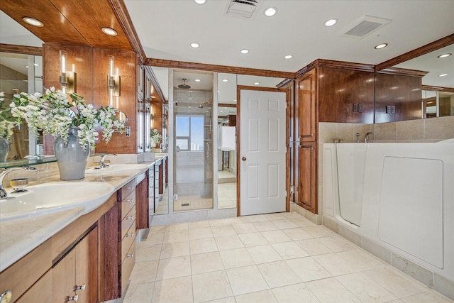 bathroom with separate shower and tub, tile patterned flooring, and vanity