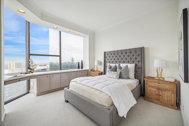 bedroom featuring multiple windows, crown molding, and light colored carpet