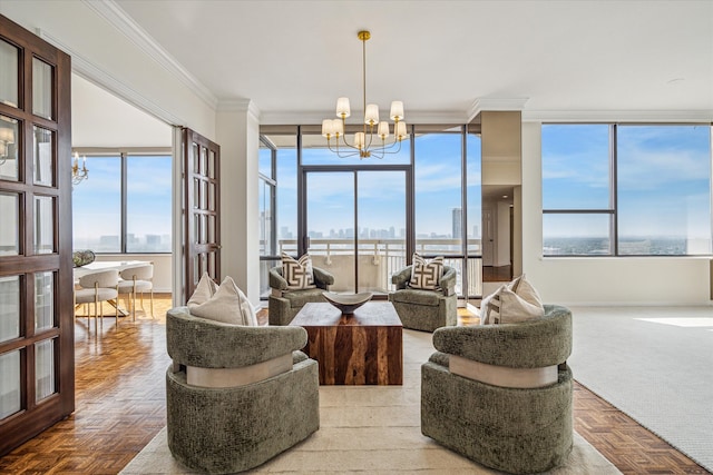 living room with a wall of windows, parquet flooring, crown molding, and an inviting chandelier