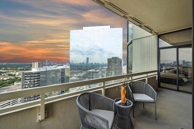 view of balcony at dusk