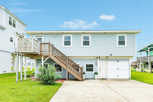 view of front facade with driveway, a garage, stairway, a wooden deck, and a front yard