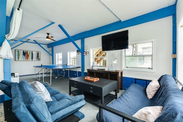 living area featuring a ceiling fan