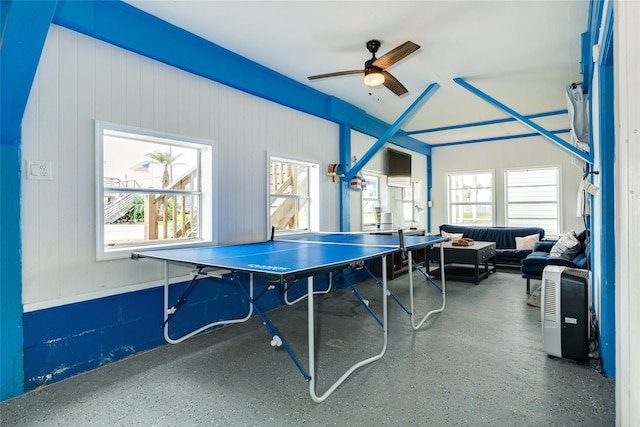 playroom with ceiling fan and speckled floor