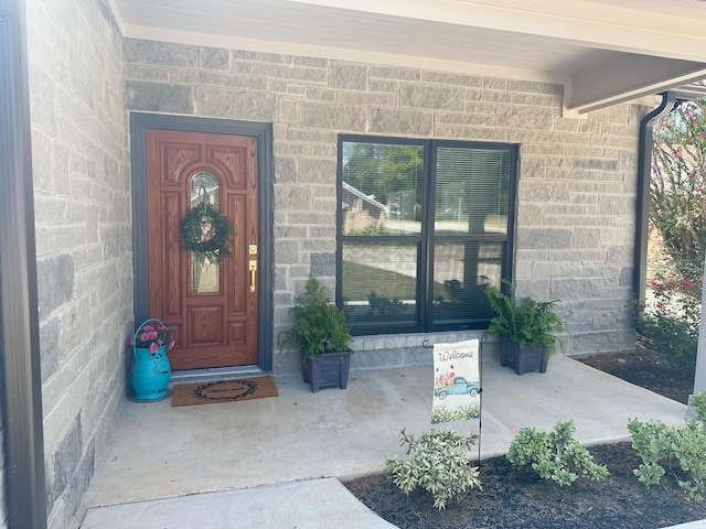 129 S Grace St, Crockett, TX 75835 - view of exterior entry featuring stone siding
