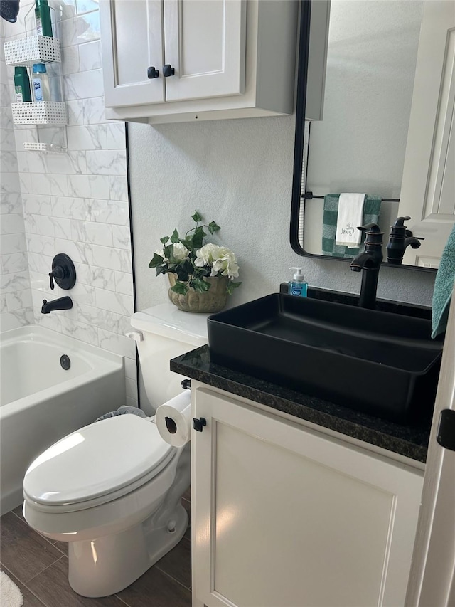 129 S Grace St, Crockett, TX 75835 - full bathroom featuring vanity, toilet, and  shower combination