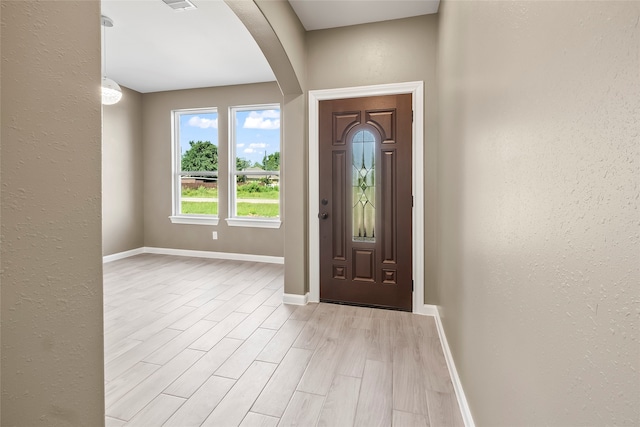 foyer with light hardwood / wood-style floors