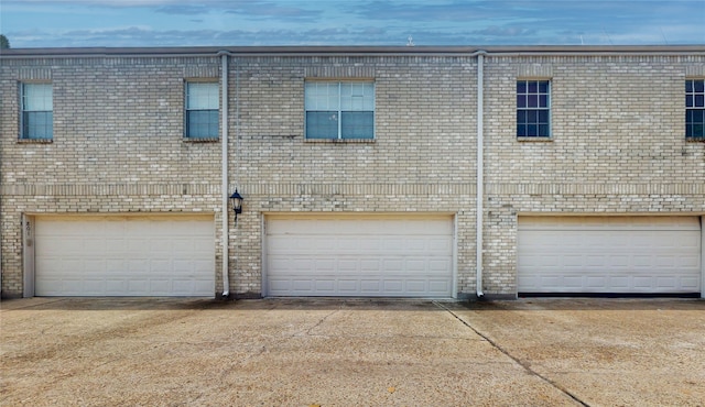 multi unit property featuring a garage