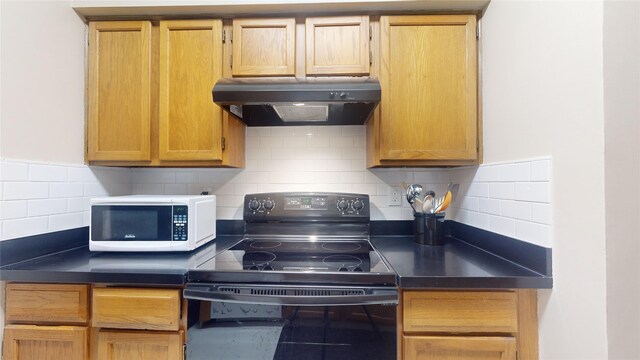 kitchen featuring tasteful backsplash and black electric range