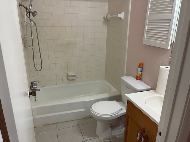 full bathroom featuring tile patterned floors, vanity, toilet, and tiled shower / bath